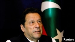 FILE - Former Pakistani Prime Minister Imran Khan pauses as he speaks with Reuters during an interview, in Lahore, Pakistan March 17, 2023.