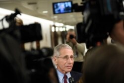 Dr. Anthony Fauci, head of the National Institute of Allergy and Infectious Diseases, talks to reporters before the start of a closed all-senators briefing on the coronavirus on Capitol Hill in Washington, Jan. 24, 2020.