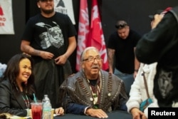 Native American activist Leonard Peltier, imprisoned for most of his life for the murder of two FBI agents, reacts after receiving a leather vest as a gift at a welcoming party in Belcourt, North Dakota, after being released from prison, Feb. 19, 2025.