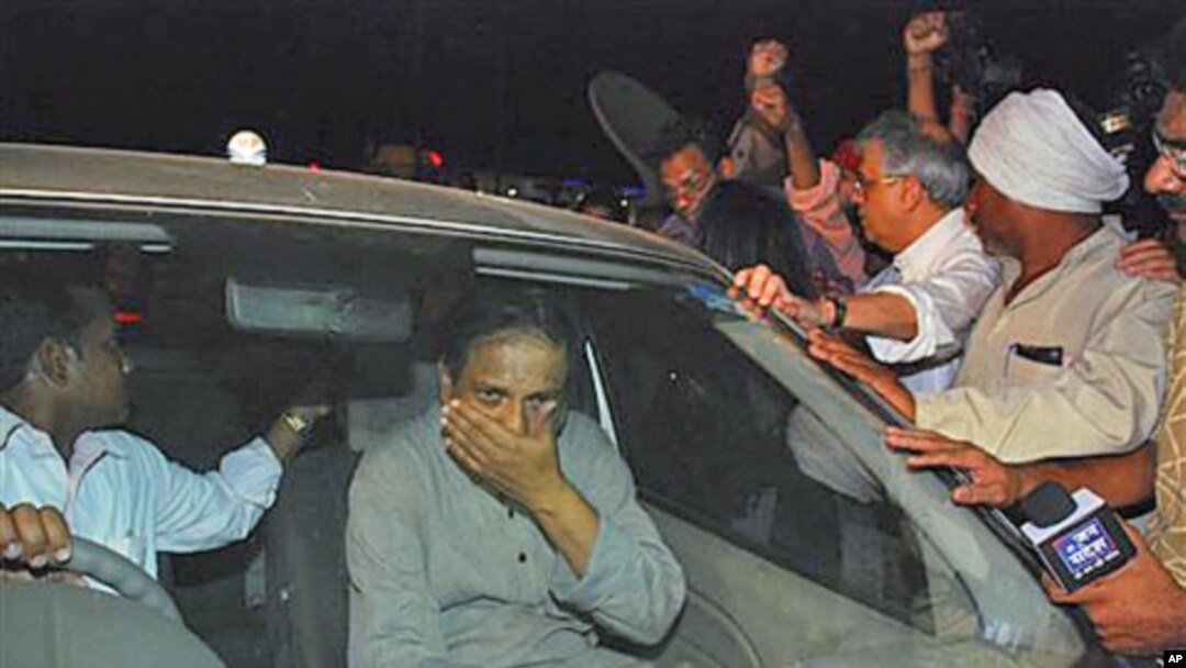 Jailed Indian doctor and human rights activist Binayak Sen, center, is mobbed by his family and supporters as he sits in a car after his release from the prison in Raipur, Chattisgarh state, India, April 18, 2011