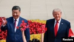 U.S. President Donald Trump participates in an welcome ceremony with Chinese President Xi Jinping at the Great Hall of the People in Beijing, China, May 14, 2026.