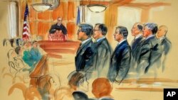 This courtroom sketch depicts Paul Manafort, fourth from right, standing with his lawyers in front of U.S. district Judge T.S. Ellis III, center rear, and the selected jury, seated left, during the jury selection of his trial at the Alexandria Federal Courthouse in Alexandria, Virginia, July 31, 2018.