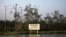 A warning sign belonging to the company Royal Dutch Shell is seen along the Nembe creek in Nigeria's oil state of Bayelsa, December 2, 2012 file photo. 