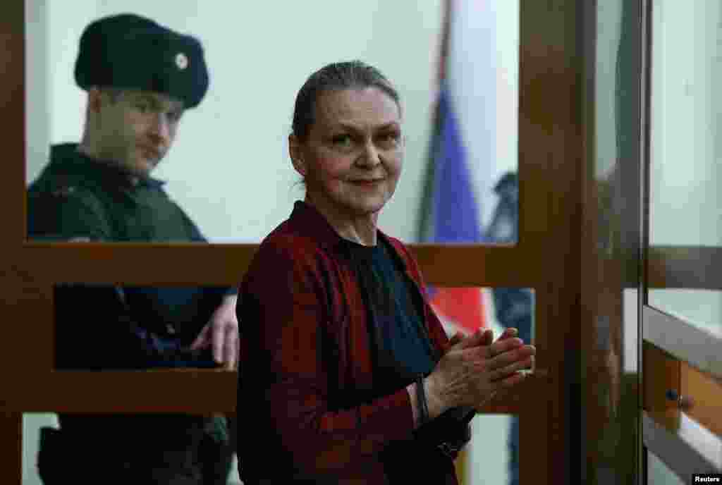 Russian journalist Nadezhda Kevorkova, who was detained in May 2024 on allegations of "justifying terrorism," stands inside an enclosure for defendants while waiting for the verdict announcement during a court hearing in Moscow, Russia. Kevorkova was found guilty, fined and released from custody.