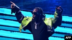 FILE — Nigerian singer Burna Boy performs during the half time show of the NBA All-Star game at the Vivint arena in Salt Lake City, Utah, February 19, 2023.