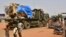 FILE — A military truck belonging to Niger's security forces escorts a French Army military as they crossed the Lazaret district in Niamey, Oct 10, 2023. 
