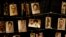 FILE —Family photographs of some of those who died hang on display in an exhibition at the Kigali Genocide Memorial center in the capital Kigali, Rwanda Friday, April 5, 2019. 