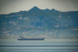FILE - A view of a vessel, the Clavel, sailing on international waters crossing the Gibraltar stretch, May 20, 2020. Five Iranian tankers likely carrying gasoline and similar products are now sailing to Venezuela from Iran.