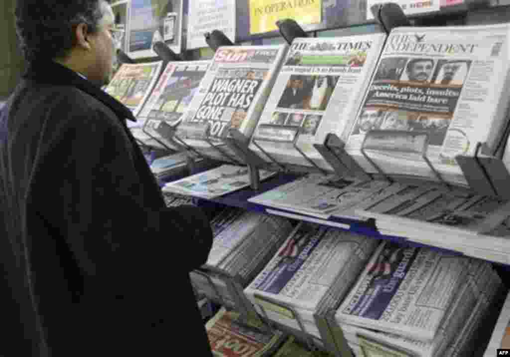 A man views a news stand displaying national newspapers, some carrying the story on WikiLeaks' release of classified U.S. State Department documents, at a newsagent in central London, Monday, Nov. 29, 2010. The online whistleblower WikiLeaks released clas