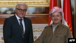 German Foreign Minister Frank-Walter Steinmeier shakes hands with the Iraqi Kurdish leader Massud Barzani (R) before a meeting on Aug. 16, 2014 in Irbil, the capital of the Kurdish autonomous region of northern Iraq. 