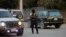 FILE - A police officer patrols a street in Port-au-Prince, Haiti, Dec. 11, 2024. Security units worked Feb. 8, 2025, to disrupt activities organized by the 400 Mawozo gang.