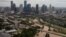 The Houston skyline is seen in the background as Buffalo Bayou is floods from Tropical Storm Harvey in Texas, Aug. 30, 2017. 