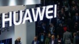 FILE - A logo of Huawei is seen during the Mobile World Congress in Barcelona, Spain.