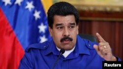 Venezuela's President Nicolas Maduro talks during a meeting with ministers at Miraflores Palace in Caracas, Sept. 3, 2014.