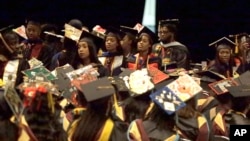 A group of students stand and turn their backs during a commencement exercise speech by U.S. Secretary of Education Betsy DeVos at Bethune-Cookman University in Daytona Beach, Florida, May 10, 2017.