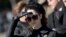 FILE - Actress Natalie Portman, in the role of Jacqueline Kennedy, is seen outside the White House while filming a scene for the movie "Jackie" on Pennsylvania Avenue in Washington, D.C., Feb. 28, 2016.