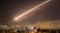 Damascus skies erupt with surface to air missile fire as the U.S. launches an attack on Syria targeting different parts of the Syrian capital Damascus, Syria, early Saturday, April 14, 2018.