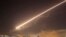 Damascus skies erupt with surface to air missile fire as the U.S. launches an attack on Syria targeting different parts of the Syrian capital Damascus, Syria, early Saturday, April 14, 2018.