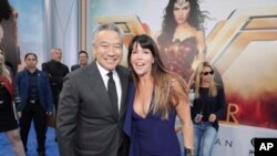FILE - Kevin Tsujihara, then-Chairman and CEO of Warner Bros., and Director Patty Jenkins seen at The World Premiere of Warner Bros. Pictures "Wonder Woman" at The Pantages Theatre May 25, 2017, in Los Angeles.