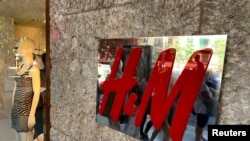 An H&M sign is seen at the entrance to an H&M store in Palma on the island of Mallorca, Spain June 14, 2019. 