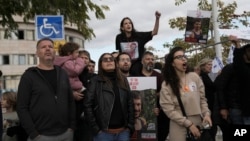 People react as a military helicopter carrying Israeli hostages arrives at the Sheba Hospital in Ramat Gan, Israel, Feb. 8, 2025, after they were released from Hamas captivity in Gaza.