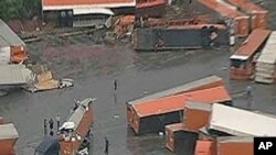 Trucks damaged by a tornado in Lancaster, Texas, March 3, 2012.