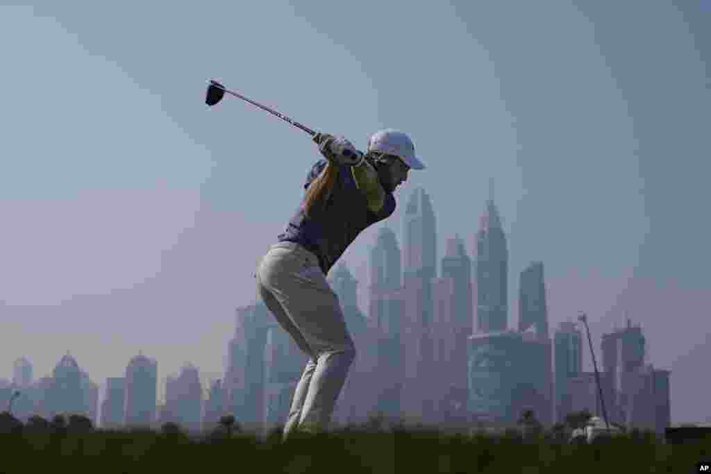 Tommy Fleetwood of England tees off at the 8th hole during the second round of the Dubai Desert Classic golf tournament, in Dubai, United Arab Emirates.