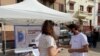 Volunteers show residents how to install an app to trace contacts with people potentially infected with the coronavirus disease (COVID-19) being trialled on the Canary Island of La Gomera