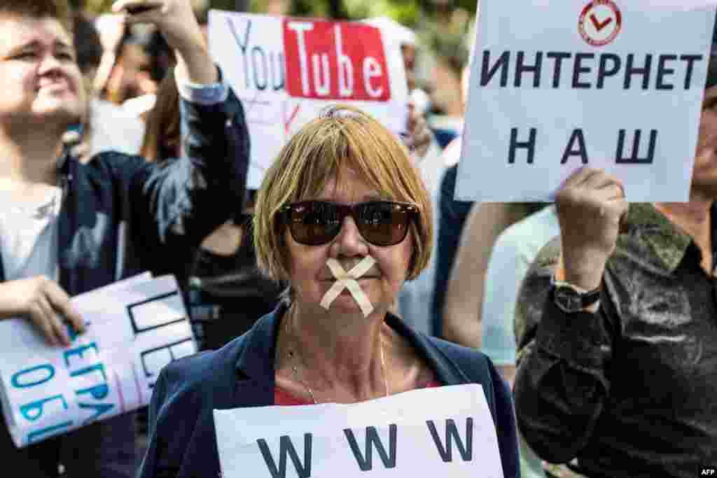 A protester takes part in the March for Free Internet in central Moscow, Russia.