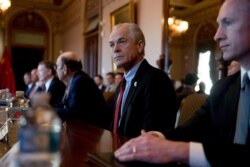 FILE - White House trade adviser Peter Navarro, center, joins other Trump administration officials as they meet with Chinese officials to begin U.S.-China trade talks on the White House complex in Washington, Jan. 30, 2019.