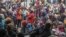 FILE - People displaced by armed gang attacks take refuge at the town hall of the Kenscoff neighborhood of Port-au-Prince, Haiti, Feb. 3, 2025. The Haitian government is canceling the national carnival that was going to be held in Fort Liberte.
