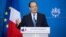 French President Francois Hollande addresses the media at the end of a two-day EU summit in Brussels, Dec. 20 2013