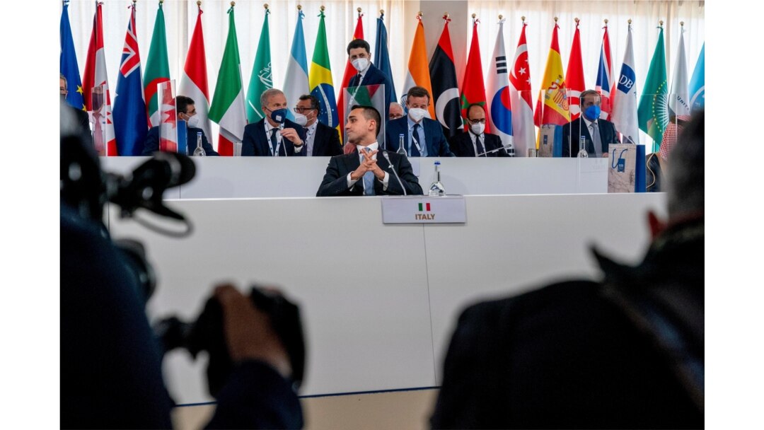 Italy's Foreign Minister Luigi Di Maio sits down to begin a G20 foreign ministers meeting in Matera, Italy, June 29, 2021.
