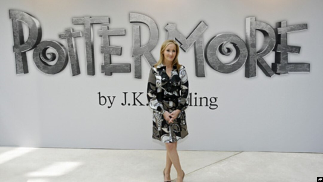 British author J.K. Rowling poses for photographers as she announces her new website project Pottermore at the Victoria and Albert Museum in London, June 23, 2011