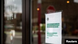 A Starbucks frequented by Syracuse University students displays precautionary measures as the threat of coronavirus spreads, New York, March 12, 2020. 