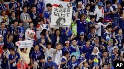 Japan fans at the end of their group H match between Japan and Senegal at the 2018 soccer World Cup at the Yekaterinburg Arena in Yekaterinburg, Russia, Sunday, June 24, 2018. (AP Photo/Mark Baker)