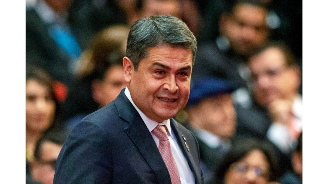 FILE - Honduras' President Juan Orlando Hernandez arrives for a swearing-in ceremony in Guatemala City, Jan. 14, 2020.