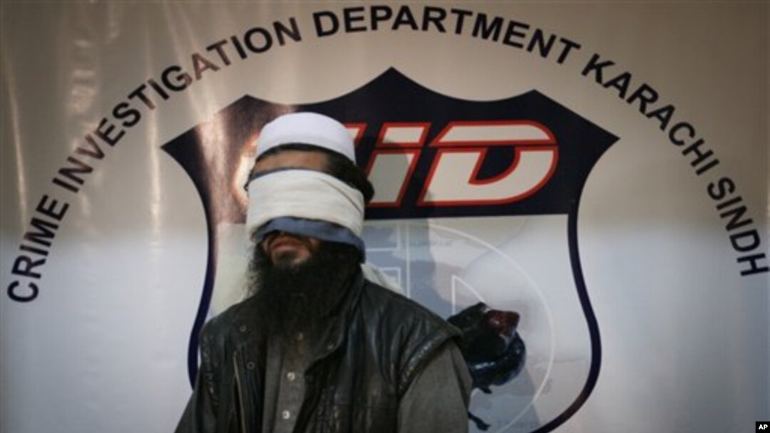 Pakistan officials present an unnamed, alleged Taliban commander to media shortly after confirming the capture the Afghan Taliban's No. 2 leader commander, Mullah Abdul Ghani Baradar, Karachi, Feb. 17, 2010.