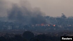 د نومبر د ۱۳ نېټې په دې تصویر کې په غزه کې د جګړې یو منظر لیدل کېږي