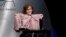 Sally Field holds up a sweater worn by her character in "Forrest Gump" as she presents the career achievement award at the 20th annual Costume Designers Guild Awards at The Beverly Hilton hotel on Tuesday, Feb. 20, 2018, in Beverly Hills, California. 