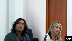 Grab taken from a handout video released by Colombia's Superior Council of the Judiciary, showing Nicolas Petro, son of Colombian President Gustavo Petro (L), and his ex-wife Daysuris Vasquez, attending a court hearing in Bogota on July 30, 2023, a day af