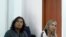 Grab taken from a handout video released by Colombia's Superior Council of the Judiciary, showing Nicolas Petro, son of Colombian President Gustavo Petro (L), and his ex-wife Daysuris Vasquez, attending a court hearing in Bogota on July 30, 2023, a day af