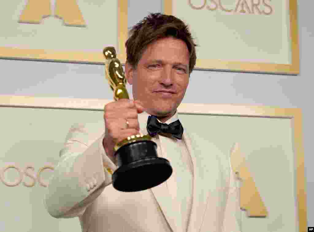 Thomas Vinterberg, from Denmark poses with the award for best international feature film for &quot;Another Round&quot; in the press room at the Oscars on Sunday, April 25, 2021, at Union Station in Los Angeles. (AP Photo/Chris Pizzello, Pool)