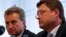 FILE - EU Energy Commissioner Guenther Oettinger (L) and Russian Energy Minister Alexander Novak are seen at a news conference in Berlin May 19, 2014.