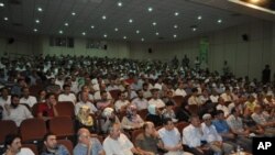 Senior Hamas leader Ismail Haniyeh waves to people as they celebrate what they say is a victory over Israel after an eight-day conflict, Gaza City, November 22, 2012. 