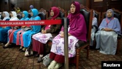 Family Love Alliance (AILA) members attend a trial at Indonesia's constitutional court in Jakarta, Indonesia, Dec. 14, 2017. The court denied their petition.