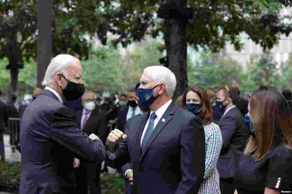 Democratic presidential candidate and former U.S. Vice President Joe Biden and Vice President Mike Pence greet each other during the 19th anniversary of the 9/11 attacks at the National September 11 Memorial &amp; Museum in New York City, New York.