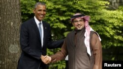 FILE - U.S. President Barack Obama greets Bahrain Crown Prince Salman bin Hamad Al-Khalifa while hosting the six-nation Gulf Cooperation Council (GCC) at Camp David in Maryland, May 14, 2015. 