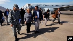 Chile's President Michelle Bachelet, center, arrives at the airport in Iquique, Chile, on April 2nd. 