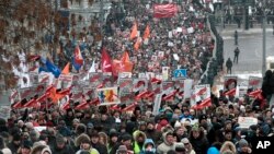 People march during a protest against Russia's new law banning Americans from adopting Russian children in Moscow, January 13, 2013. 